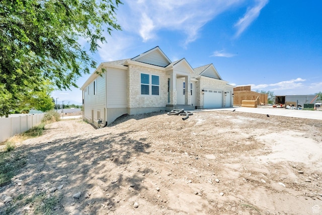 761 W 880 N, American Fork, UT 84003 - view of front of home with an attached garage, driveway, and stone siding