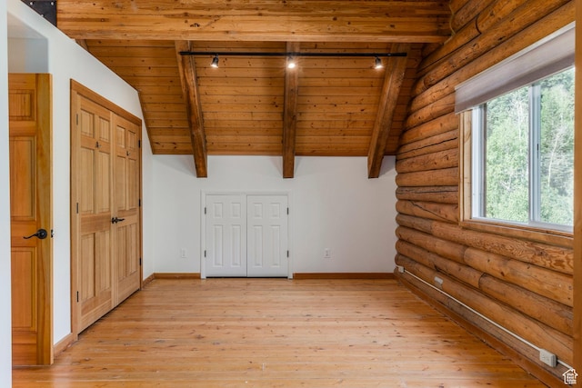 1796 W Tollgate Canyon Rd, Wanship, UT 84017 - unfurnished room with rail lighting, a wooden ceiling with exposed beams, healthy amount of natural light, light wood finished floors, and log walls