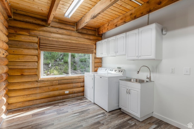 1796 W Tollgate Canyon Rd, Wanship, UT 84017 - laundry area featuring rustic walls, washer and clothes dryer, cabinet space, wood ceiling, and light wood-style flooring