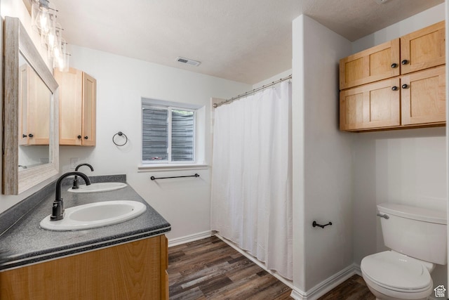 1796 W Tollgate Canyon Rd, Wanship, UT 84017 - bathroom with wood finished floors, double vanity, and curtained shower