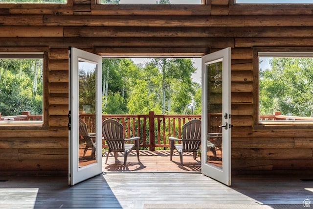 1796 W Tollgate Canyon Rd, Wanship, UT 84017 - doorway with rustic walls, wood-type flooring, and french doors