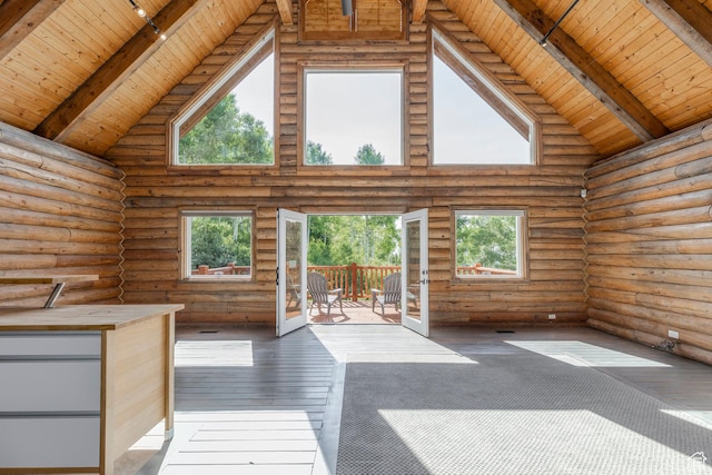 1796 W Tollgate Canyon Rd, Wanship, UT 84017 - unfurnished living room with a wood ceiling with exposed beams, high vaulted ceiling, rustic walls, and wood-type flooring