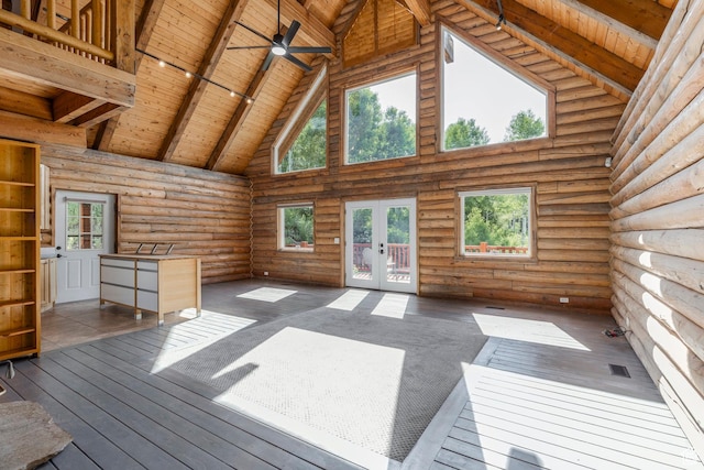 1796 W Tollgate Canyon Rd, Wanship, UT 84017 - unfurnished living room with a wood ceiling with exposed beams, high vaulted ceiling, rustic walls, french doors, and ceiling fan