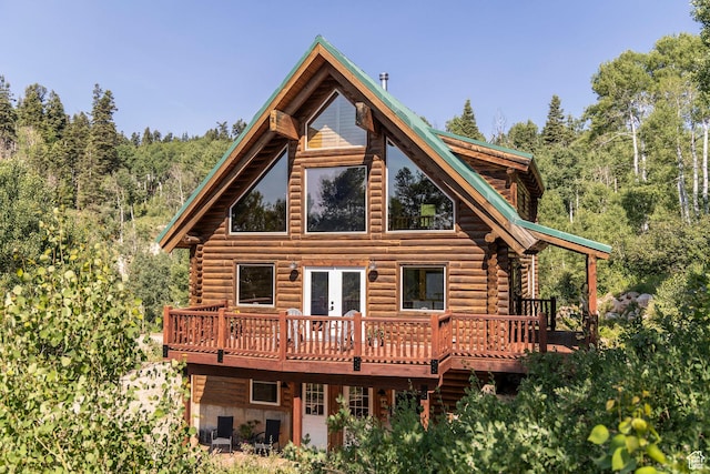 1796 W Tollgate Canyon Rd, Wanship, UT 84017 - back of property featuring log exterior, a wooden deck, and a view of trees