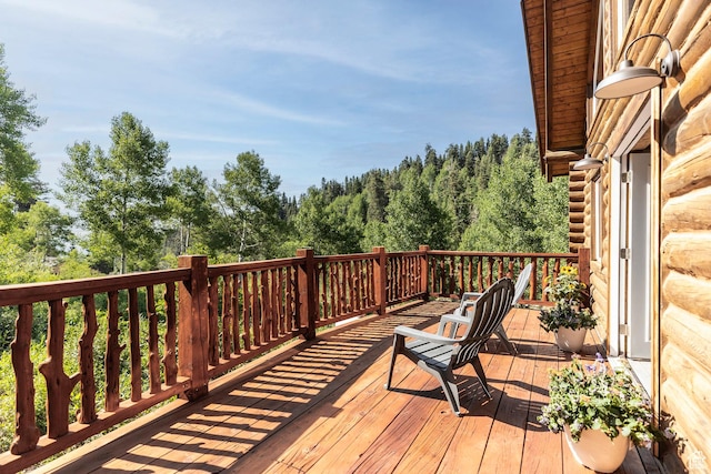 1796 W Tollgate Canyon Rd, Wanship, UT 84017 - wooden deck featuring a wooded view