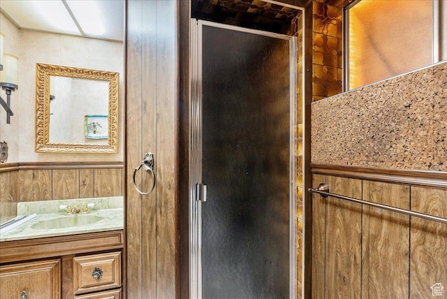 6690 S 1495 E, Cottonwood Heights, UT 84121 - full bathroom with vanity, a stall shower, wooden walls, and a wainscoted wall