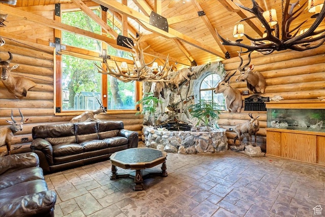 6690 S 1495 E, Cottonwood Heights, UT 84121 - living area featuring a chandelier, a wooden ceiling with exposed beams, high vaulted ceiling, stone tile flooring, and log walls