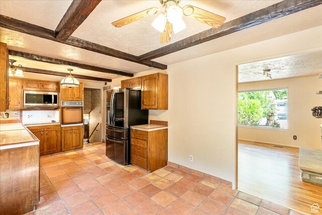 6690 S 1495 E, Cottonwood Heights, UT 84121 - kitchen with stainless steel microwave, smart refrigerator, beamed ceiling, oven, and brown cabinetry
