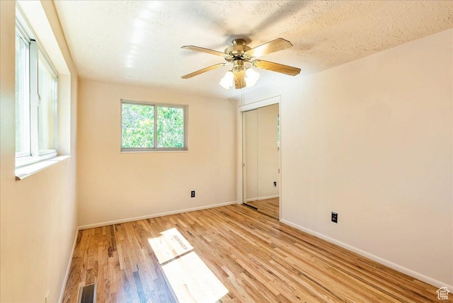 6690 S 1495 E, Cottonwood Heights, UT 84121 - spare room with light wood-style floors, a ceiling fan, and a textured ceiling