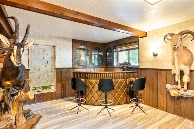 6690 S 1495 E, Cottonwood Heights, UT 84121 - indoor dry bar featuring beamed ceiling, a textured ceiling, wood finished floors, wainscoting, and wood walls