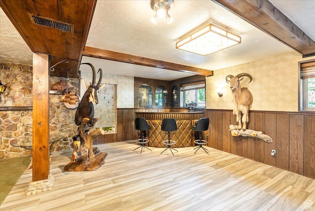 6690 S 1495 E, Cottonwood Heights, UT 84121 - indoor dry bar with beam ceiling, a wainscoted wall, plenty of natural light, wood finished floors, and wooden walls