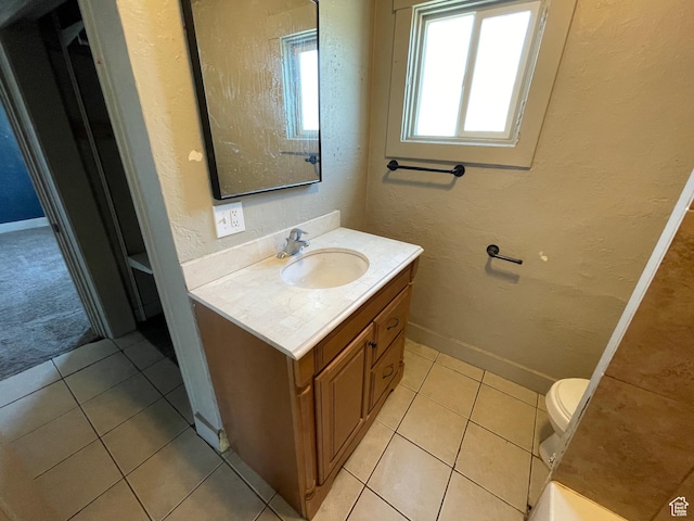 2163 Adams Ave, Ogden, UT 84401 - bathroom with vanity, tile patterned flooring, and a textured wall