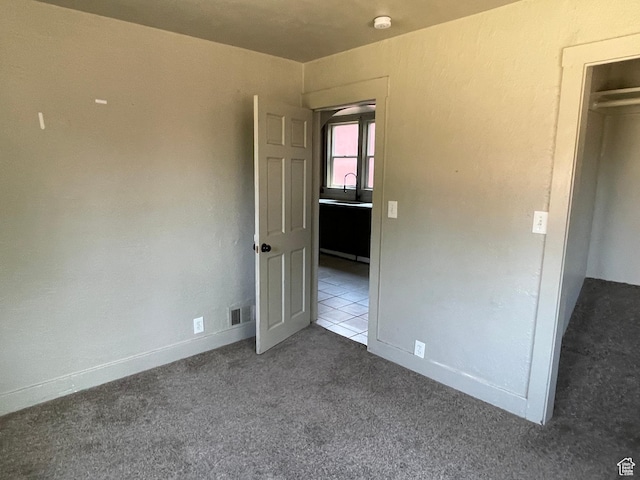 2163 Adams Ave, Ogden, UT 84401 - unfurnished bedroom with carpet floors and a sink