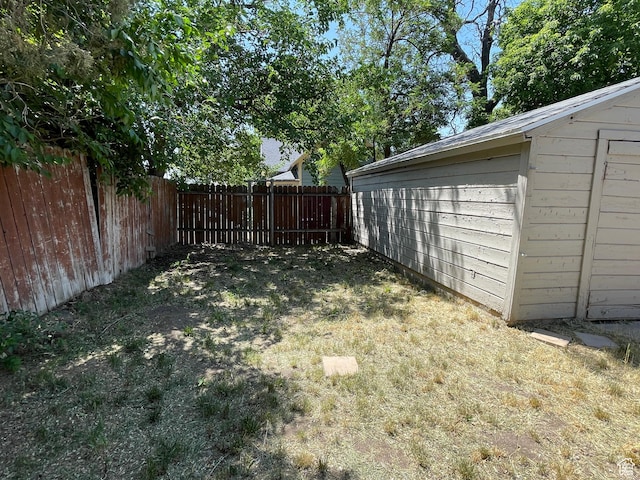 2163 Adams Ave, Ogden, UT 84401 - fenced backyard featuring an outbuilding