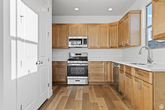 2162 W 320 S Unit 51, Hurricane, UT 84737 - kitchen with stainless steel appliances, light wood-style floors, light countertops, and recessed lighting
