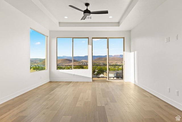 2162 W 320 S Unit 51, Hurricane, UT 84737 - spare room featuring a mountain view, a raised ceiling, ceiling fan, light wood-type flooring, and recessed lighting