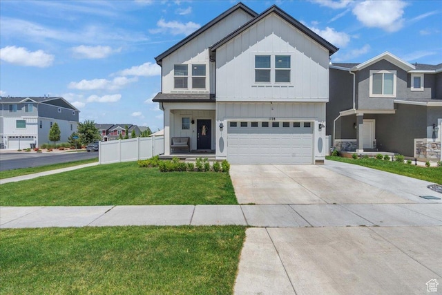 1128 E Bearing Dr S, Saratoga Springs, UT 84045 - view of front facade featuring board and batten siding, a garage, driveway, and a residential view