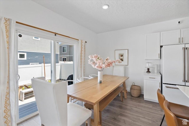 1128 E Bearing Dr S, Saratoga Springs, UT 84045 - dining room featuring healthy amount of natural light, light wood-type flooring, and a textured ceiling
