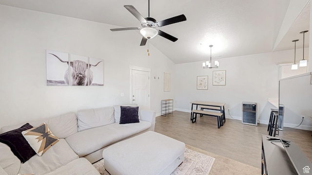 3715 W 1480 N Unit 303, Lehi, UT 84043 - living area with ceiling fan, beverage cooler, light wood-style flooring, high vaulted ceiling, and a chandelier