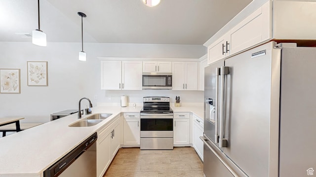 3715 W 1480 N Unit 303, Lehi, UT 84043 - kitchen featuring stainless steel appliances, a peninsula, light countertops, and white cabinetry