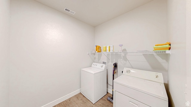 3715 W 1480 N Unit 303, Lehi, UT 84043 - laundry area with washer and dryer and light wood-style flooring
