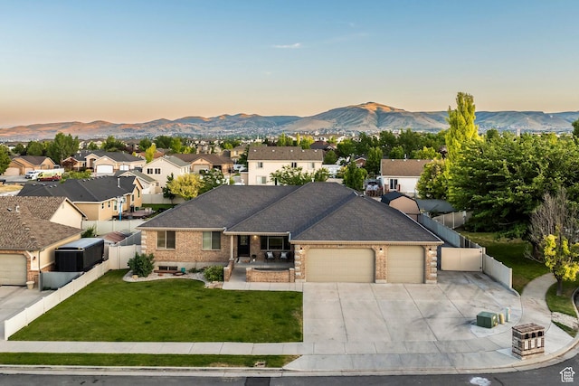 5689 W Sandy Stone Cir S, South Jordan, UT 84009 - ranch-style house featuring a garage, brick siding, driveway, a mountain view, and a residential view