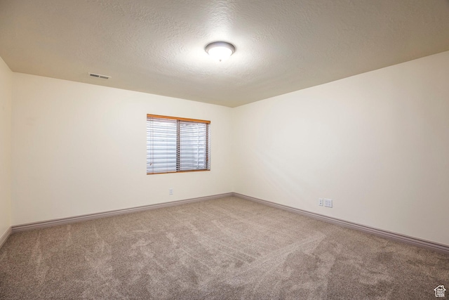 5689 W Sandy Stone Cir S, South Jordan, UT 84009 - carpeted spare room featuring a textured ceiling and baseboards