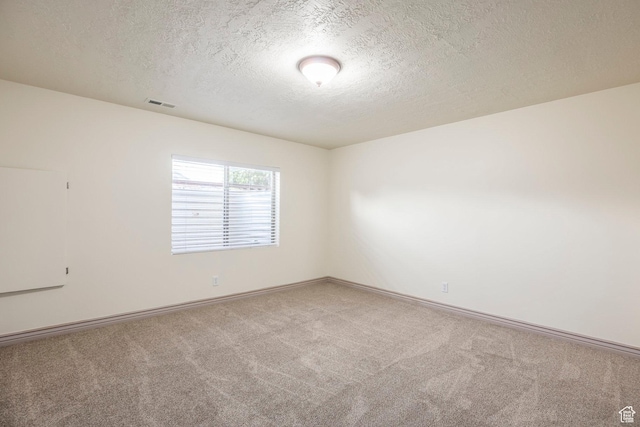 5689 W Sandy Stone Cir S, South Jordan, UT 84009 - spare room with a textured ceiling and carpet flooring
