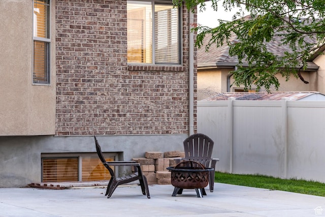 5689 W Sandy Stone Cir S, South Jordan, UT 84009 - view of patio / terrace with a fire pit