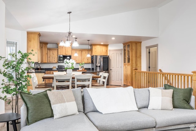 5689 W Sandy Stone Cir S, South Jordan, UT 84009 - living area with vaulted ceiling, a chandelier, and recessed lighting
