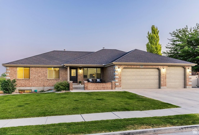 5689 W Sandy Stone Cir S, South Jordan, UT 84009 - single story home featuring a garage, brick siding, a lawn, concrete driveway, and a shingled roof