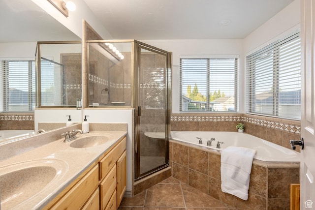 5689 W Sandy Stone Cir S, South Jordan, UT 84009 - bathroom with a garden tub, a stall shower, tile patterned floors, and double vanity
