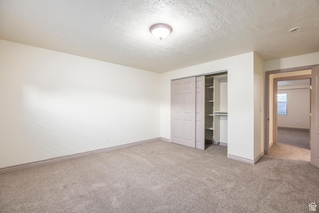 5689 W Sandy Stone Cir S, South Jordan, UT 84009 - unfurnished bedroom featuring carpet flooring, a textured ceiling, and a closet