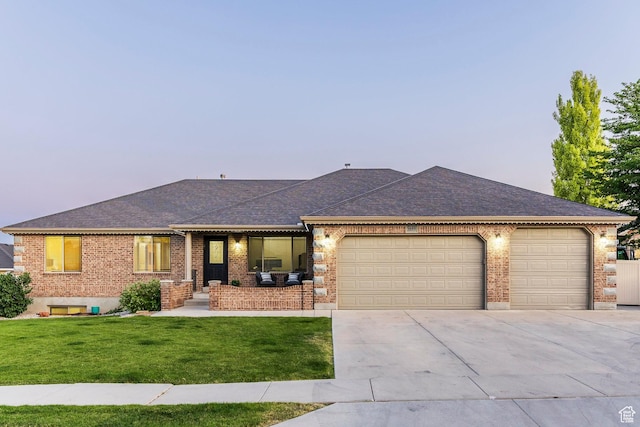 5689 W Sandy Stone Cir S, South Jordan, UT 84009 - single story home with an attached garage, driveway, a yard, brick siding, and roof with shingles