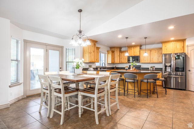 5689 W Sandy Stone Cir S, South Jordan, UT 84009 - dining room featuring recessed lighting, vaulted ceiling, light tile patterned floors, and a chandelier