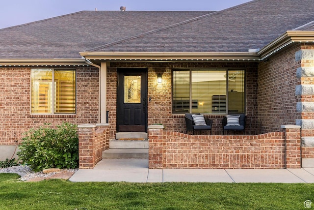 5689 W Sandy Stone Cir S, South Jordan, UT 84009 - view of exterior entry featuring brick siding and roof with shingles