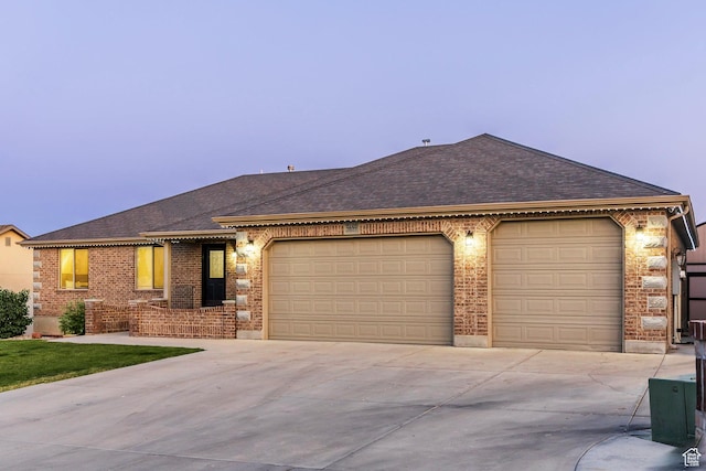 5689 W Sandy Stone Cir S, South Jordan, UT 84009 - ranch-style home with driveway, an attached garage, roof with shingles, and brick siding
