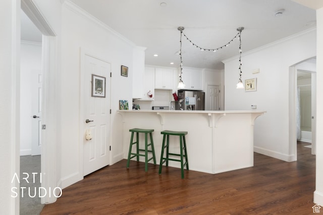 1068 Canyon Meadow Dr Unit 8, Provo, UT 84606 - kitchen featuring stainless steel fridge, a breakfast bar, crown molding, light countertops, and dark wood finished floors