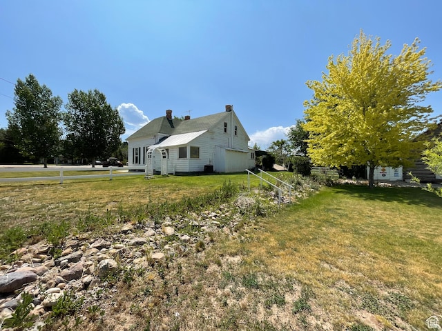 12 S Main, Holden, UT 84636 - view of side of property featuring a lawn and a chimney