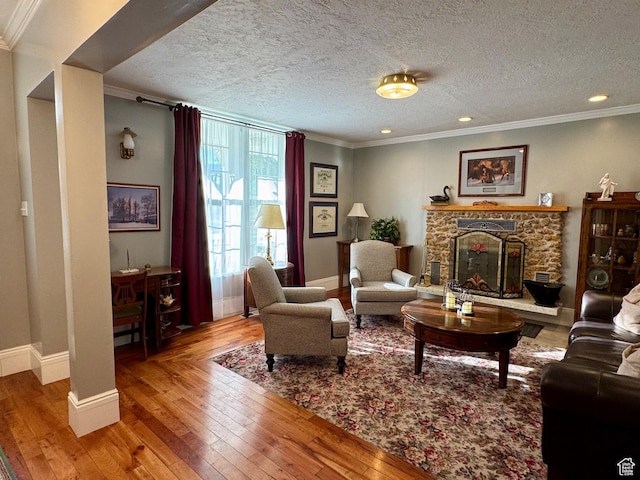12 S Main, Holden, UT 84636 - living area with wood-type flooring, a fireplace, ornamental molding, a textured ceiling, and recessed lighting
