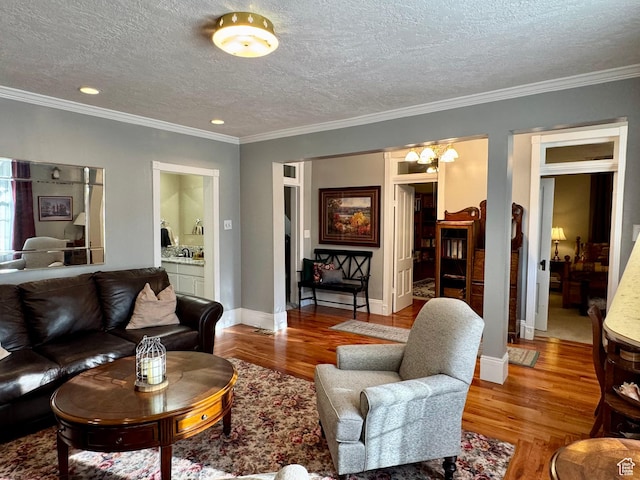 12 S Main, Holden, UT 84636 - living room featuring wood finished floors, a textured ceiling, crown molding, recessed lighting, and a chandelier