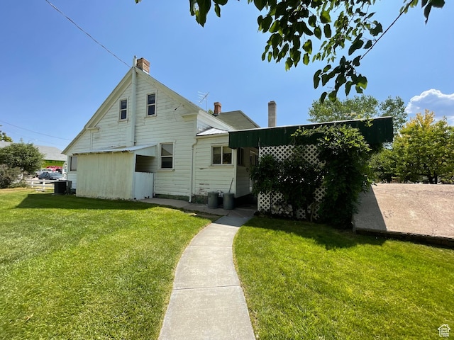 12 S Main, Holden, UT 84636 - back of property featuring a chimney and a lawn