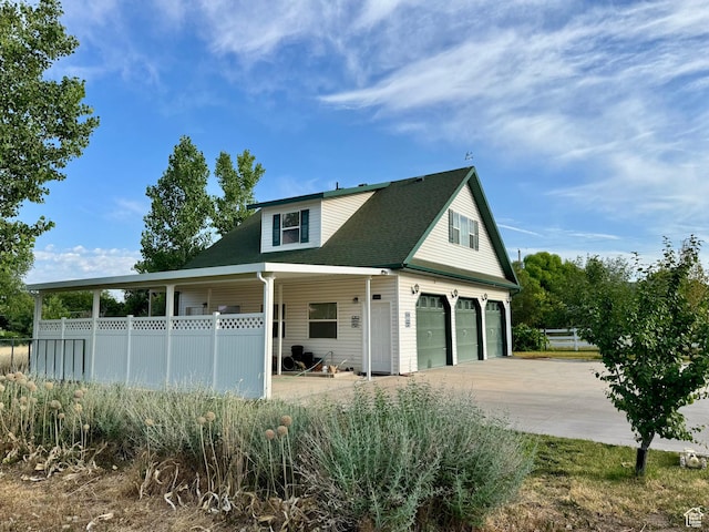 12 S Main, Holden, UT 84636 - view of front of home featuring a garage, driveway, a porch, and roof with shingles