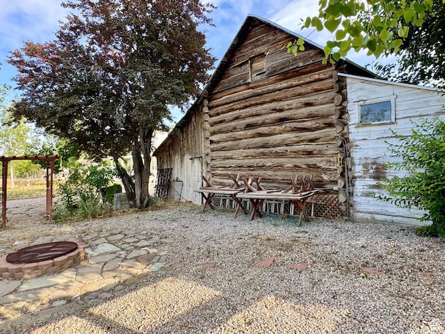12 S Main, Holden, UT 84636 - view of side of property with an outdoor fire pit and log exterior