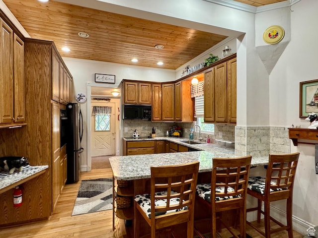 12 S Main, Holden, UT 84636 - kitchen featuring black appliances, ornamental molding, wooden ceiling, a peninsula, and light wood finished floors