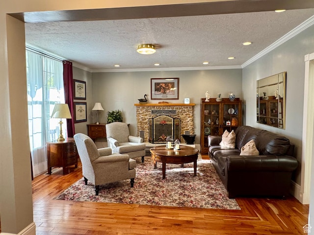 12 S Main, Holden, UT 84636 - living room featuring a stone fireplace, a textured ceiling, wood finished floors, crown molding, and recessed lighting