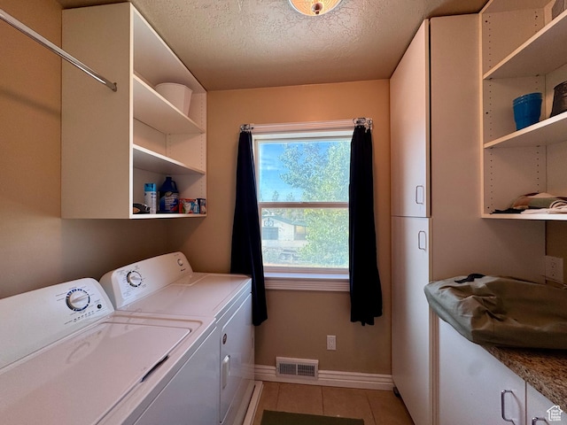 12 S Main, Holden, UT 84636 - laundry area featuring cabinet space, independent washer and dryer, light tile patterned floors, and a textured ceiling