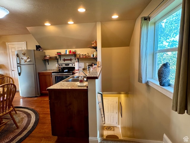 12 S Main, Holden, UT 84636 - kitchen with appliances with stainless steel finishes, dark wood-style floors, lofted ceiling, light countertops, and recessed lighting