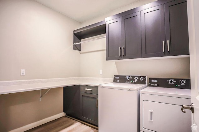 621 N Sage Hen Dr, Washington, UT 84780 - washroom with cabinet space, washing machine and dryer, and light wood-type flooring