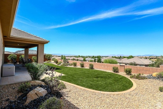 621 N Sage Hen Dr, Washington, UT 84780 - fenced backyard with a patio area and a mountain view